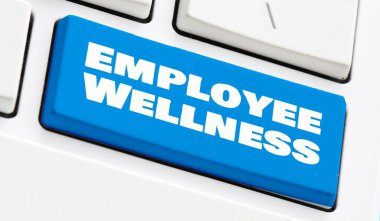 Bir bilgisayar klavyesinin mavi tuşundaki İşçi Sağlığı sözleri.