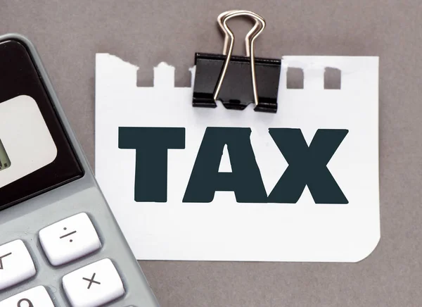 Tax Woord Een Stuk Papier Een Rekenmachine Tax Business Concept — Stockfoto