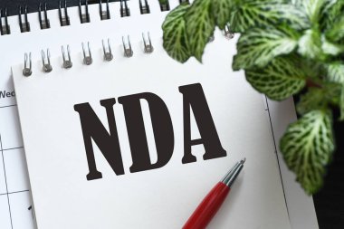 Ofis defterinde NDA kelimesi.