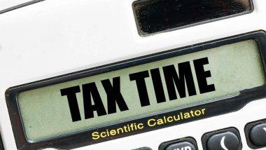TAX TIME words on calculator display. clipart