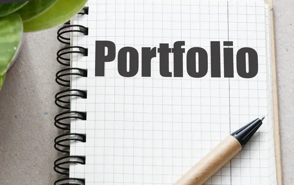 stock image The word portfolio in an office notebook.