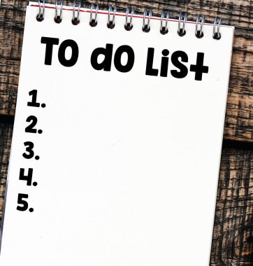 TO DO LIST words written in an office notebook. 