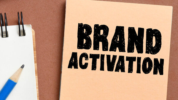 BRAND ACTIVATION words written on a small piece of paper.
