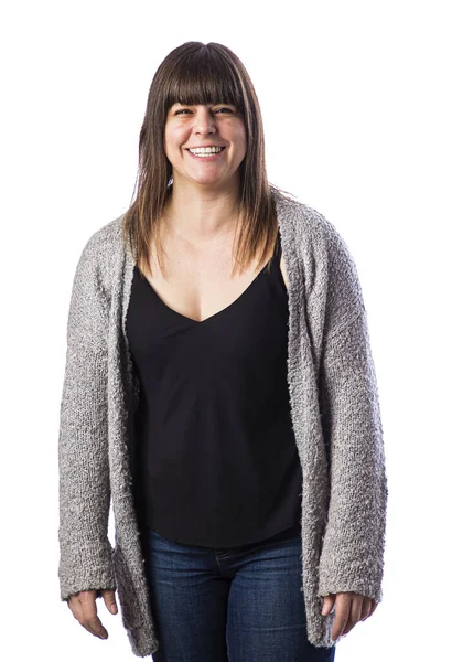 40歳の女性の孤立した肖像画 灰色のベストを着て 大きな笑顔で ストック写真