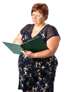 Fifty something woman holding a large green book and pointing something on a page clipart