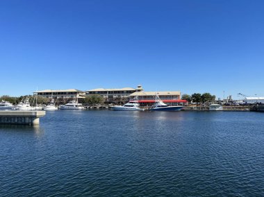 Palafox Pier in the early morning with boast docked in the bay, Pensacola, Florida