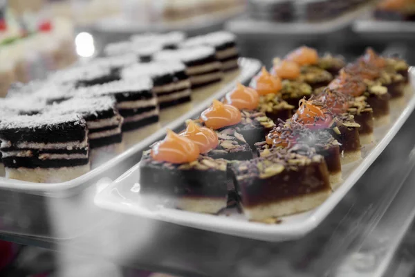 Assorted cakes on a showcase in a restaurant