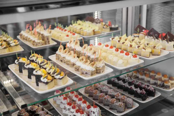 Assorted cakes on a showcase in a restaurant