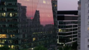 Business skyscrapers at sunset reflected in windows in Warsaw, Poland