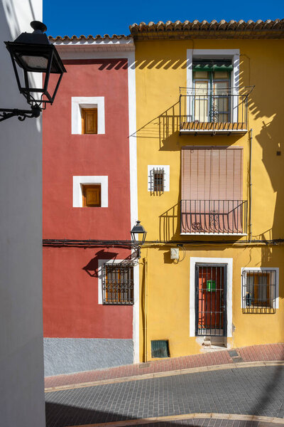 Villajoyosa street with multi-colored houses. Villajoyosa a coastal town in Alicante Province, Valencian Community, Spain, by Mediterranean Sea