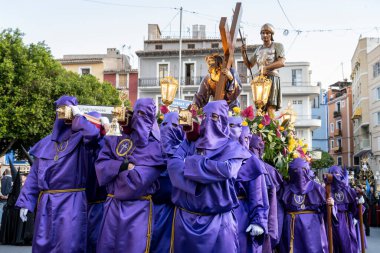 VILLAJOYOSA, SPAIN - APRIL 7, 2023: Procession during Holy Week in La Vila Joiosa going through the streets of the Old Town. The procession is organized by ten brotherhoods that are in charge of bringing out the passion, death and resurrection of Jes