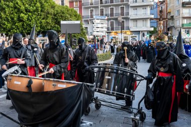 VILLAJOYOSA, SPAIN - APRIL 7, 2023: Procession during Holy Week in La Vila Joiosa going through the streets of the Old Town. The procession is organized by ten brotherhoods that are in charge of bringing out the passion, death and resurrection of Jes