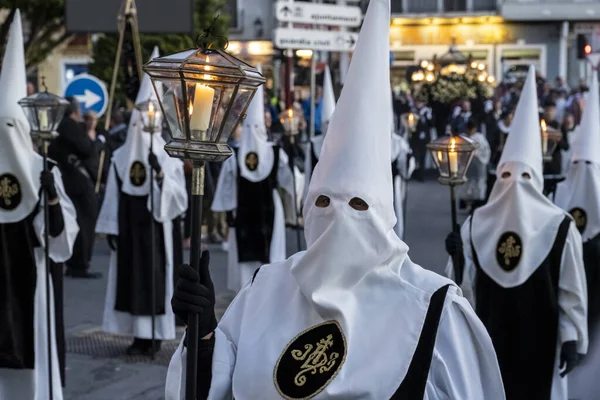 VILLAJOYOSA, SPAIN - APRIL 7, 2023: Procession during Holy Week in La Vila Joiosa going through the streets of the Old Town. The procession is organized by ten brotherhoods that are in charge of bringing out the passion, death and resurrection of Jes