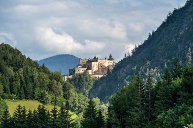 Hohenwerfen Castle was built on a rock, about 40 km south of Salzburg. The castle is majestically surrounded by the Berchtesgaden Alps and the Tennengebirge mountain range. clipart