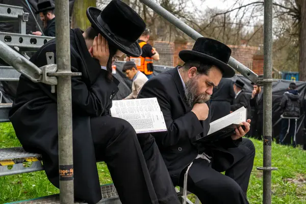 stock image Lezajsk, Poland - March 31, 2024: Members of the Jewish diasphora during the 2024 pilgrimage of Hasidic Jews from around the world to the grave of Tzadik Elimelech Weissblum in Lezajsk near Rzeszow in South-Eastern Poland.