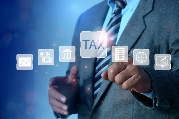 income tax concept. Businessman pointing to tax icon. pay online income tax. futuristic virtual screen interface technology.