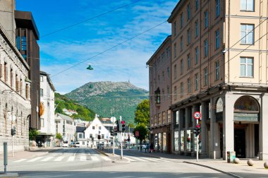 BERGEN, NORWAY - JULY 15, 2018: View from the center of Bergen towards Mount Ulriken (643 m high) - the highest of Bergen's seven local mountains.  clipart