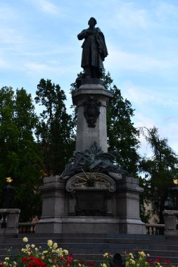 WARSAW, POLAND - JUL 10: Adam Mickiewicza Monument in Warsaw, Poland, as seen on July 10, 2022.
