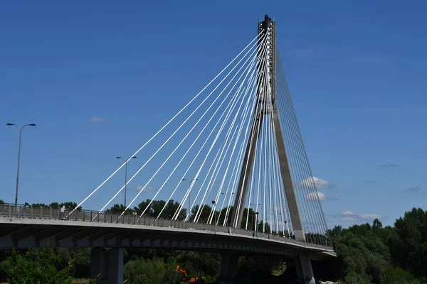 Stock image WARSAW, POLAND - JUL 3: Swietokrzyski Bridge over the Vistula River in Warsaw, Poland, as seen on July 3, 2022. 