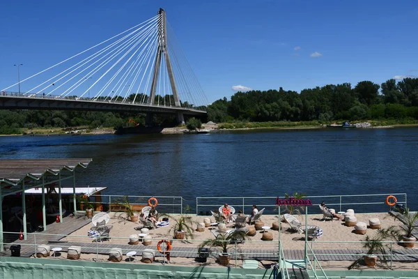 stock image WARSAW, POLAND - JUL 3: Swietokrzyski Bridge over the Vistula River in Warsaw, Poland, as seen on July 3, 2022. 