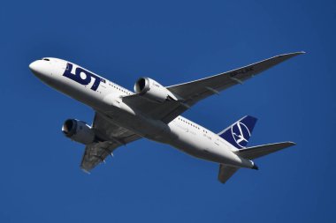 WARSAW, POLAND - JUL 14: LOT Polish Airlines in the air above Warsaw, Poland, as seen on July 14, 2022.