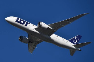 WARSAW, POLAND - JUL 14: LOT Polish Airlines in the air above Warsaw, Poland, as seen on July 14, 2022.