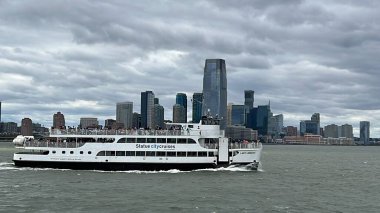 NEW YORK NY - JUN 18: Ferry by Statue City Cruises running from Manhattan to Statue of Liberty in New York City, as seen on June 18, 2022.