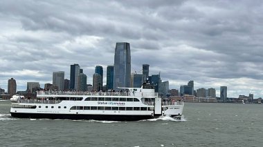 NEW YORK NY - JUN 18: Ferry by Statue City Cruises running from Manhattan to Statue of Liberty in New York City, as seen on June 18, 2022.