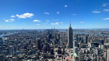 NEW YORK, NY - JUN 19: View of Manhattan including the Empire State Building from The Summit observation deck at One Vanderbilt in Manhattan, New York City, as seen on June 19, 2022.