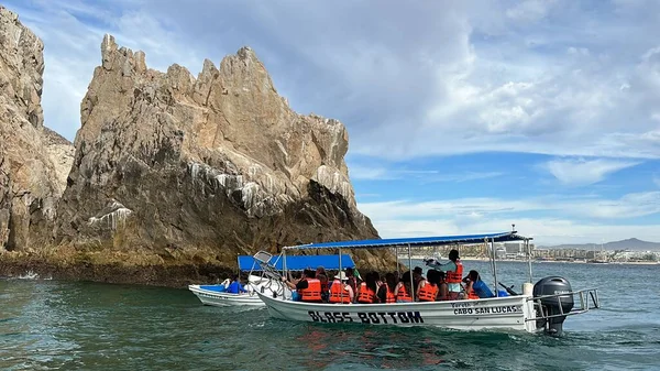 stock image CABO SAN LUCAS, MEXICO - APR 13: Boat tours near El Arco (The Arch) rock formations in Cabo San Lucas, Mexico, as seen on April 13, 2023.