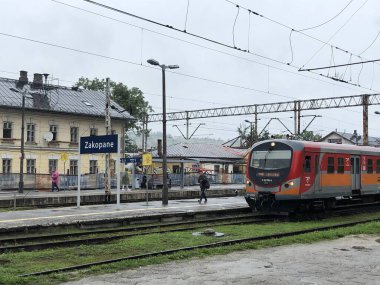 ZAKOPANE, POLAND - AUG 14: Train at the Zakopane Station in Poland, as seen on Aug 14, 2019.  clipart