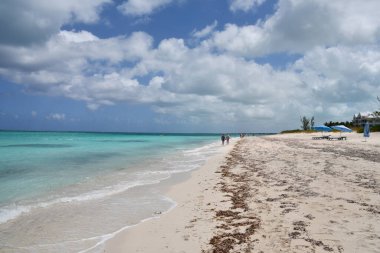 PROVIDENCIALES, TCI - APR 18: Long Bay Beach in Providenciales, in the Turks and Caicos Islands, as seen on April 18, 2024. clipart