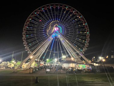 BRANSON, MO - JUL 2: ELECTRIFY A Music & Light Spectacular show at the Branson Ferris Wheel in Missouri, as seen on July 2, 2023. clipart