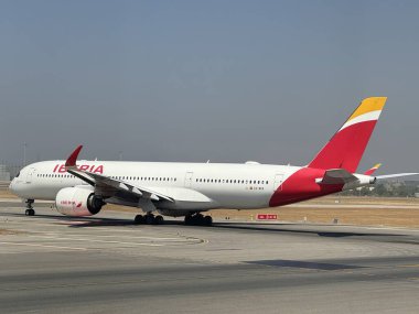 MADRID, SPAIN - AUG 19: Iberia Airlines Plane at Adolfo Suarez MadridBarajas Airport in Spain, as seen on Aug 19, 2024. clipart