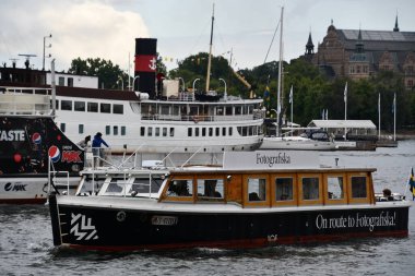 STOCKHOLM, SWEDEN - JUL 30: Fotografiska Museum by Boat in Stockholm, Sweden, as seen on July 28, 2023. clipart