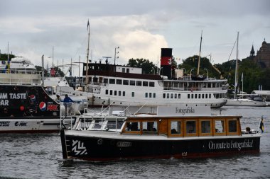 STOCKHOLM, SWEDEN - JUL 30: Fotografiska Museum by Boat in Stockholm, Sweden, as seen on July 28, 2023. clipart