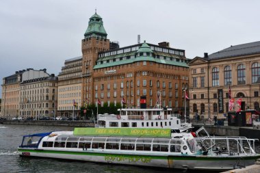 STOCKHOLM, SWEDEN - JUL 30: Hop On Hop Off Boat in Stockholm, Sweden, as seen on July 28, 2023. clipart