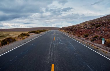 Empty asphalt road in the Peruvian Andes.