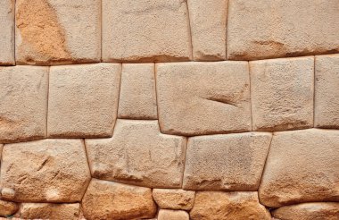 Background. Stone wall made by the Incas in Cusco, Peru.