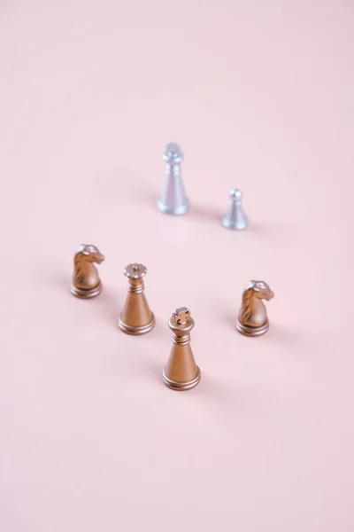 Several Gold Silver Chess Pieces Beige Background 로열티 프리 스톡 이미지