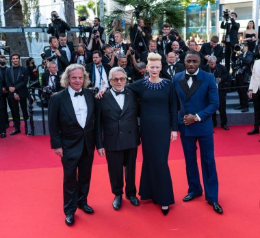 CANNES, FRANCE - MAY 20, 2022: Director George Miller, Doug Mitchell, Tilda Swinton and Idris Elba attend the screening of 
