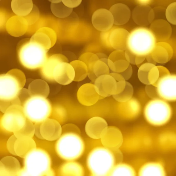 带有Bokeh灯设计的金色圣诞背景 — 图库照片