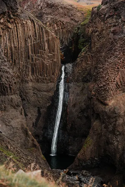 stock image Majestic Waterfall Amid Basalt Columns