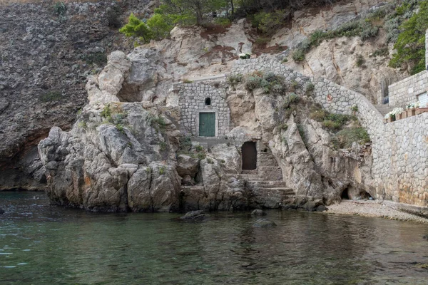 Two old doors in a cliff in a bay in Dubrovnik in Croatia