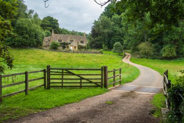 Old English Country House in the english countryside clipart