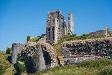 Corfe Castle is a village and civil parish in the English county of Dorset. It is the site of a ruined castle of the same name