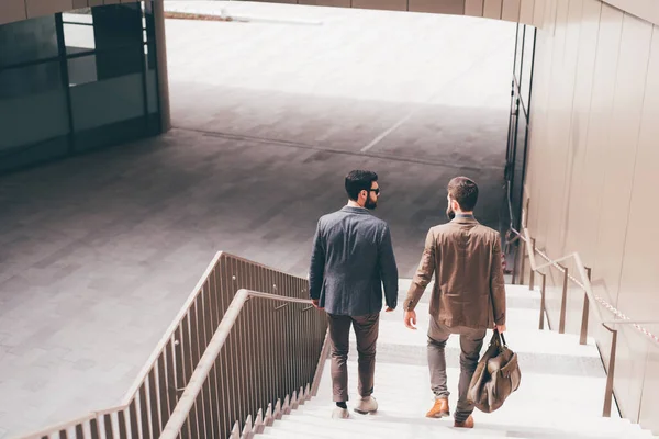 Two Young Businessmen Outdoors Walking Downstairs Talking Chatting Leaving Meeting — Stock Photo, Image