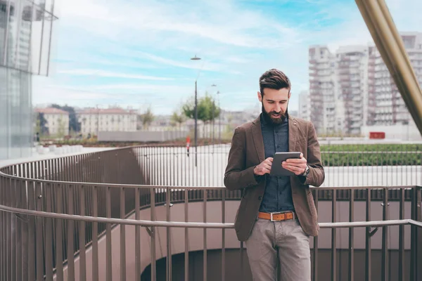 Young Bearded Man Outdoors Posing Looking Camera Holding Tablet Computer — Zdjęcie stockowe