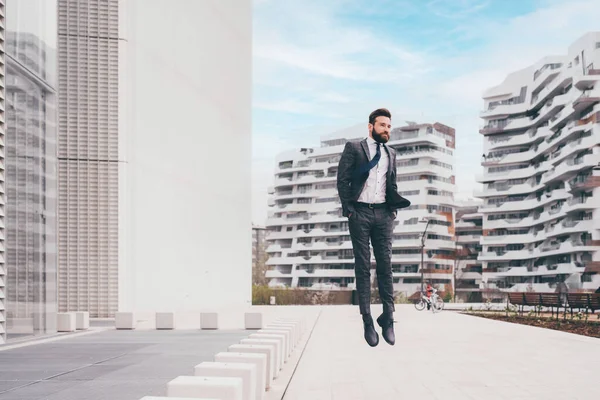 Energetic Young Bearded Professional Businessman Jumping Mid Air — Stock Photo, Image