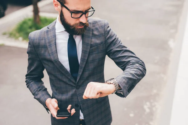 Young Professional Elegant Bearded Businessman Outdoors Checking Time Wrist Watch — Stockfoto